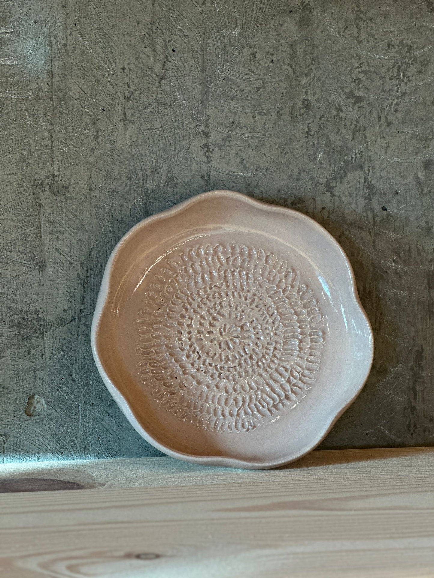 Handmade beige ceramic garlic grater