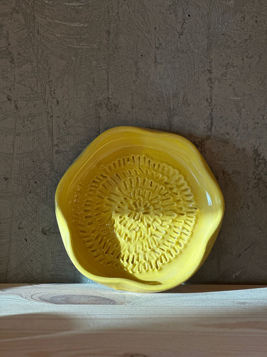 Handmade yellow ceramic garlic grater